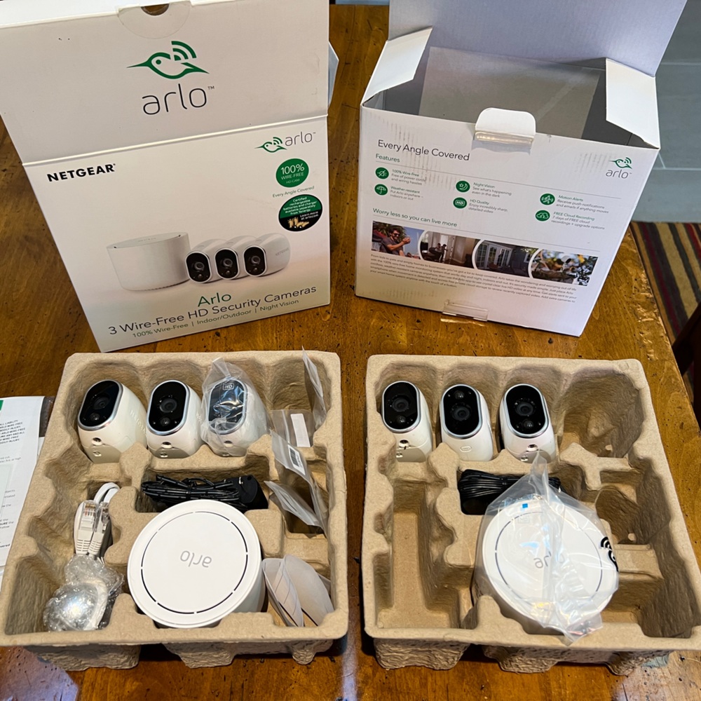 (2) Arlo Netgear HD wireless security systems. 6 cameras, two base stations